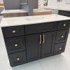Black bathroom vanity with gold handles and marble countertop by Supply Toronto