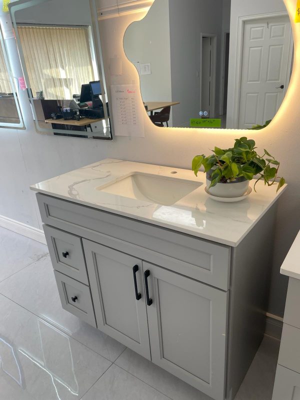 Grey bathroom vanity with drawer storage and marble countertop by Supply Toronto
