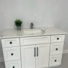 White bathroom vanity with marble countertop and black handles by Supply Toronto