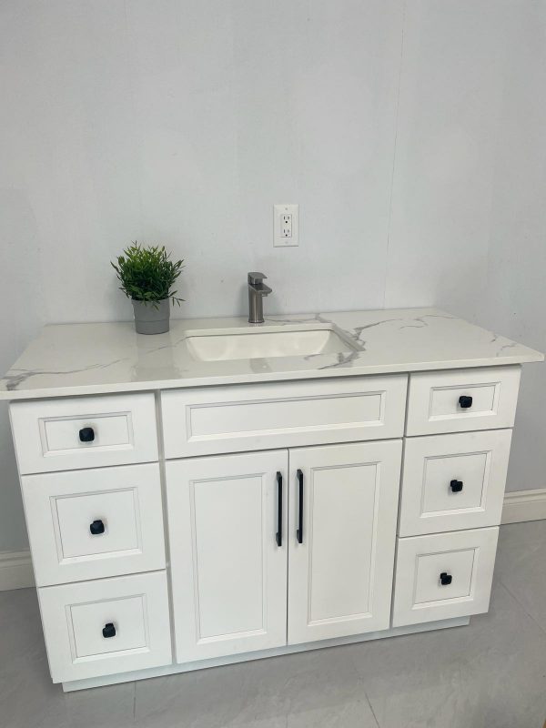 White bathroom vanity with marble countertop and black handles by Supply Toronto